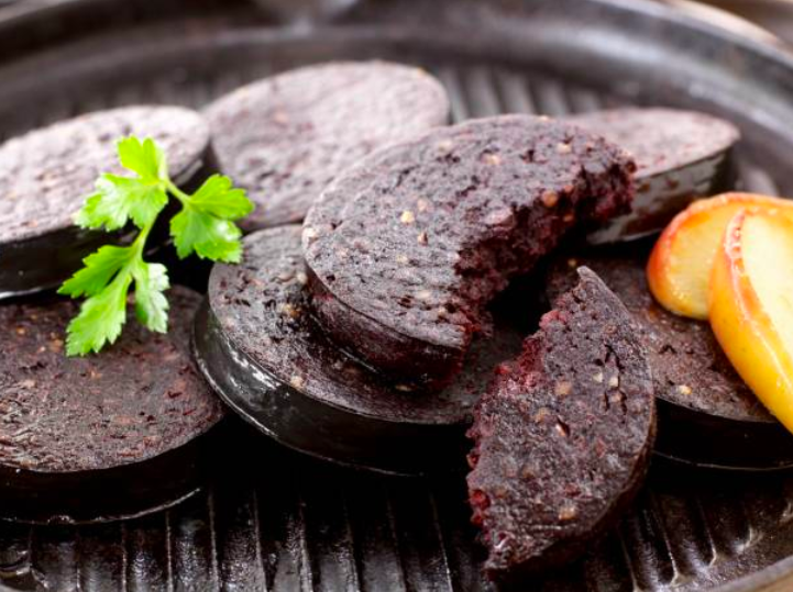 though it"s called black pudding, the blood inside gives it