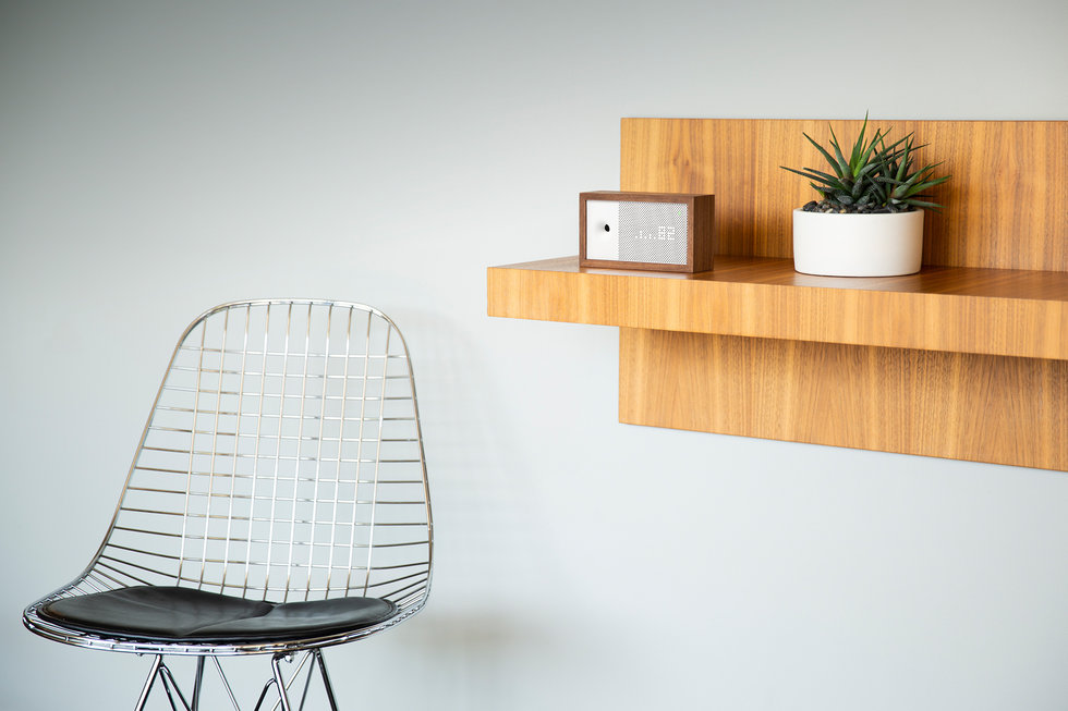 Picture of Awair air monitor on a shelf.