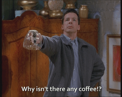 guy holding out an empty pot of coffee