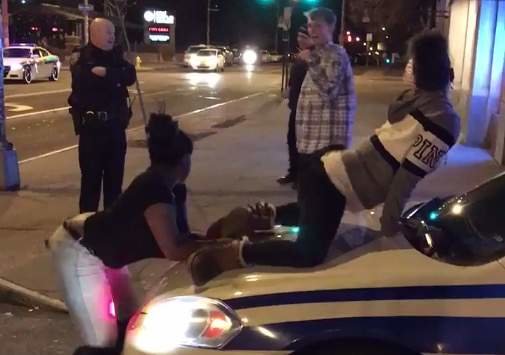 Outrageous video: Females twerk on hood of police cruiser as cop ...