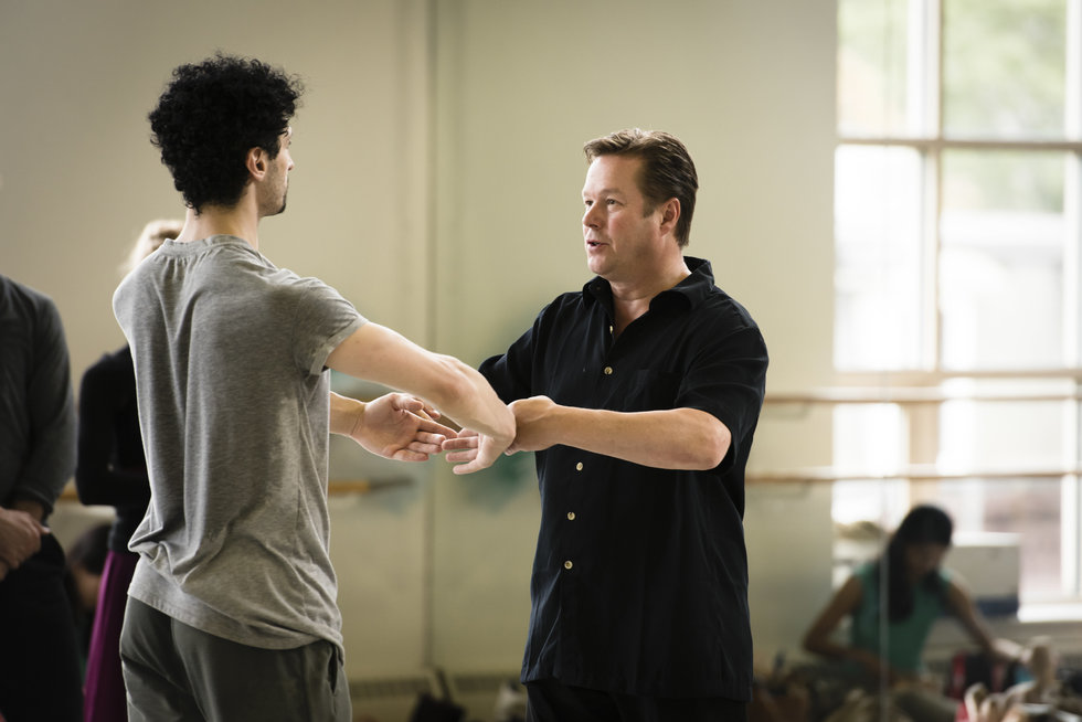 Nissinen corrects the port de bras of a dancer in rehearsal