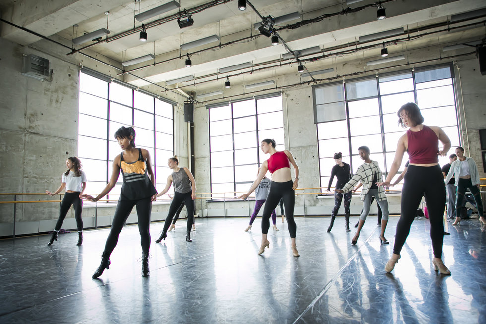 A classroom full of dancers in heels slide to the side