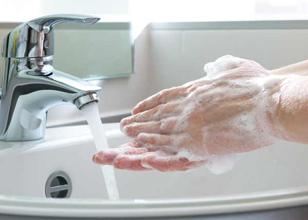 person washing their hands