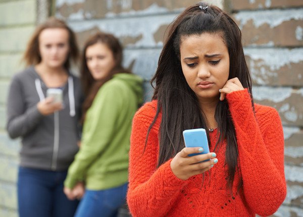 teen girls bullying another teen