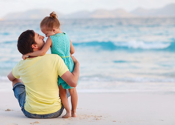 father and daughter at the beach