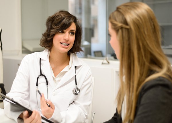 woman speaking with her doctor