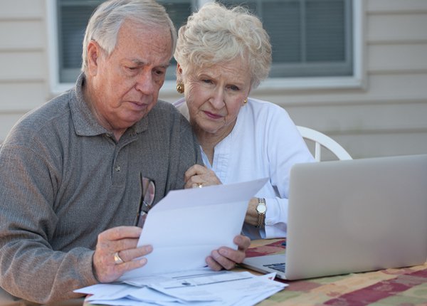 mature couple reading some documents