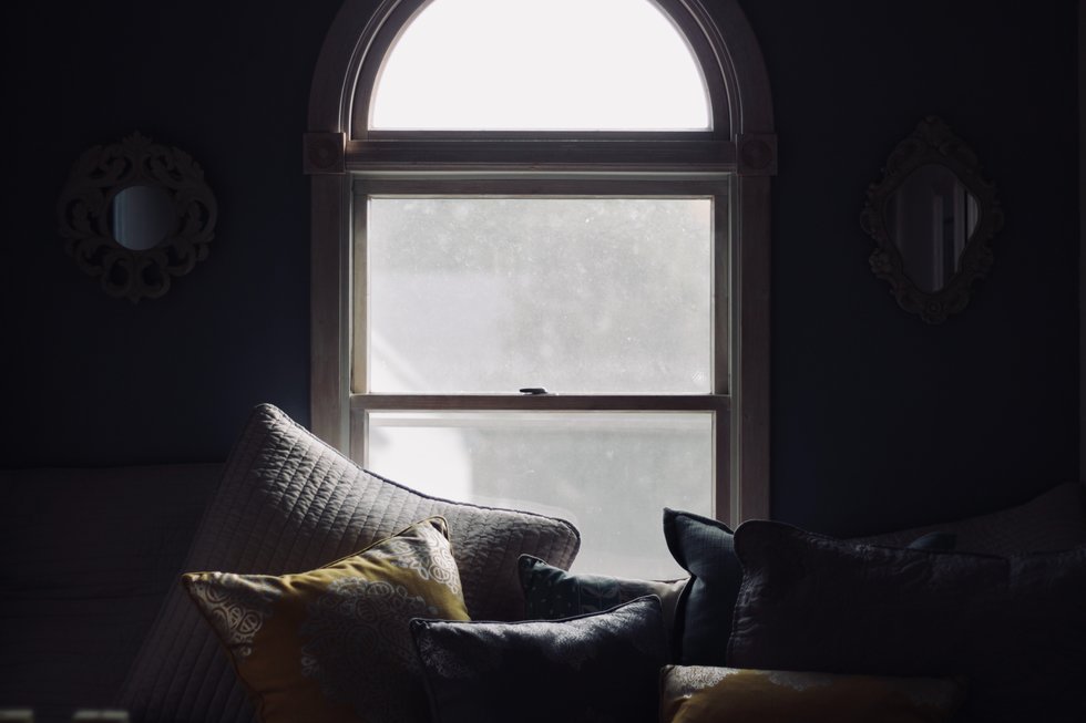 Throw pillows set against a bright window