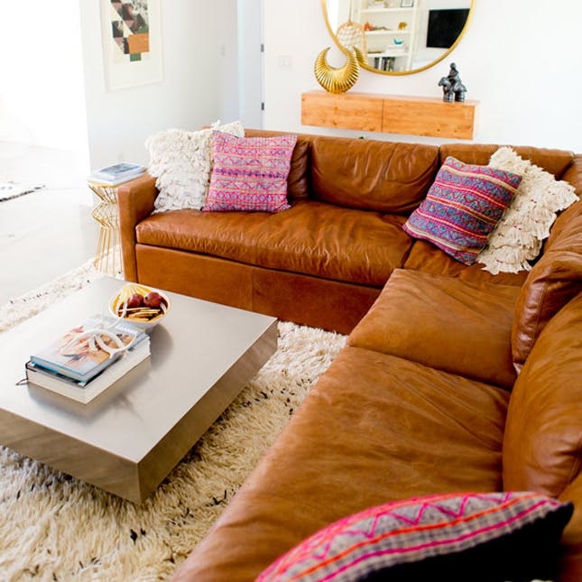 9 Ways To Rock The Leather Sofa Trend, Feminine Leather Sofa