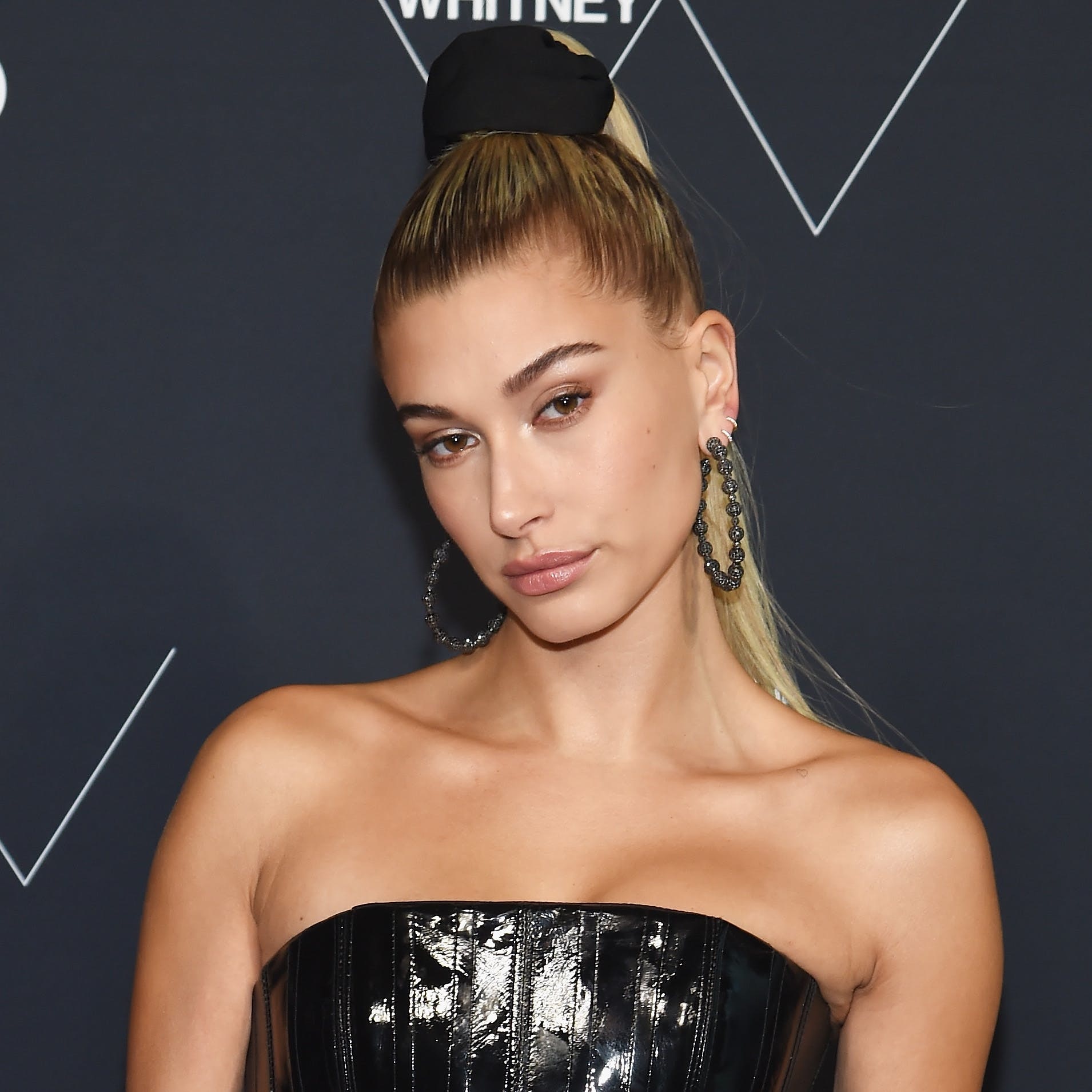 Hailey Bieber Arrives in Striking Low-Back Dress & Hidden Heels at Vanity  Fair Oscars Party 2022