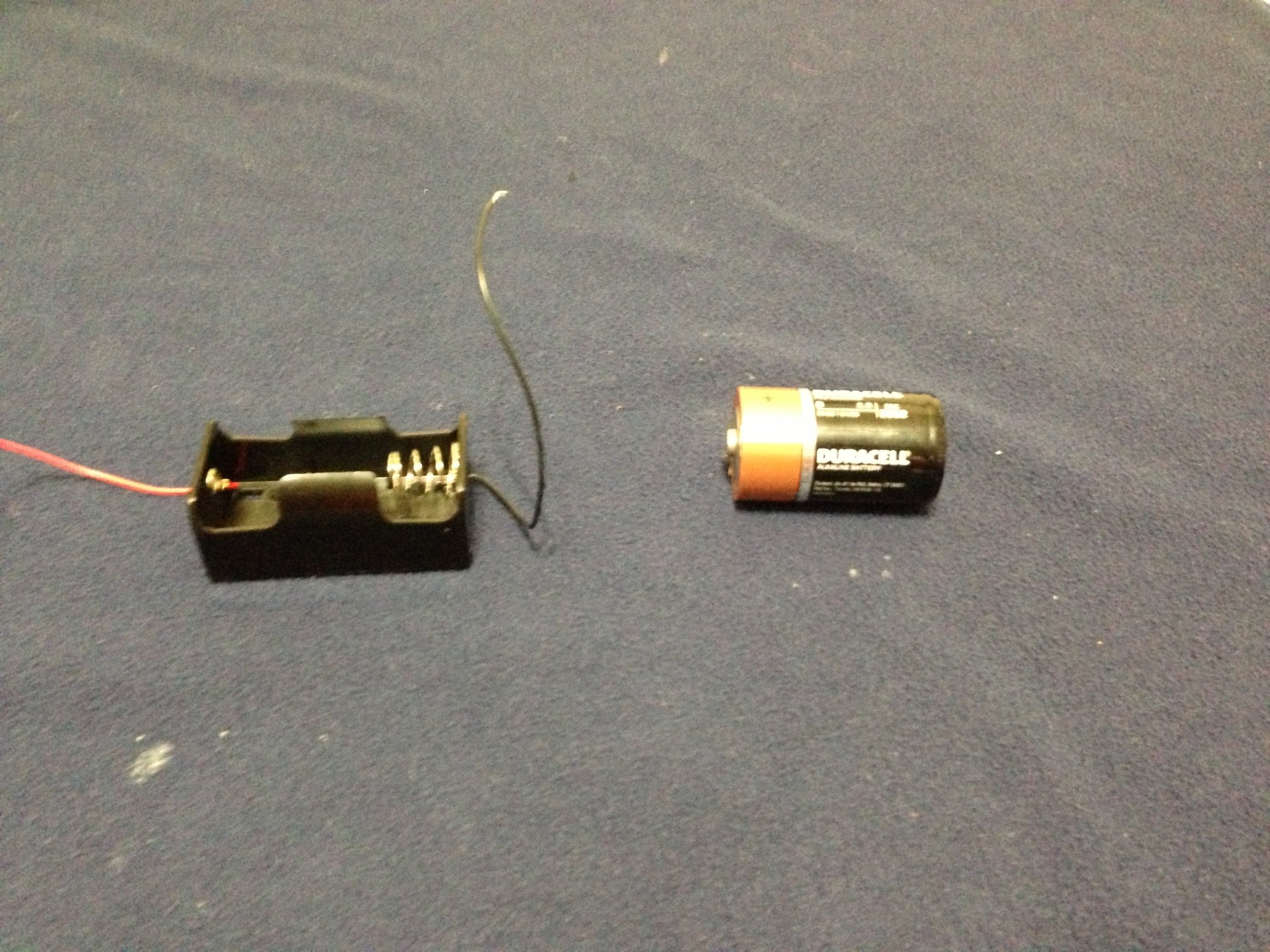 how to light up a lightbulb with a battery and wire