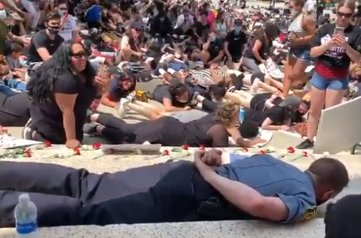 Police chiefs lays face down on ground in BLM die-in protest ...