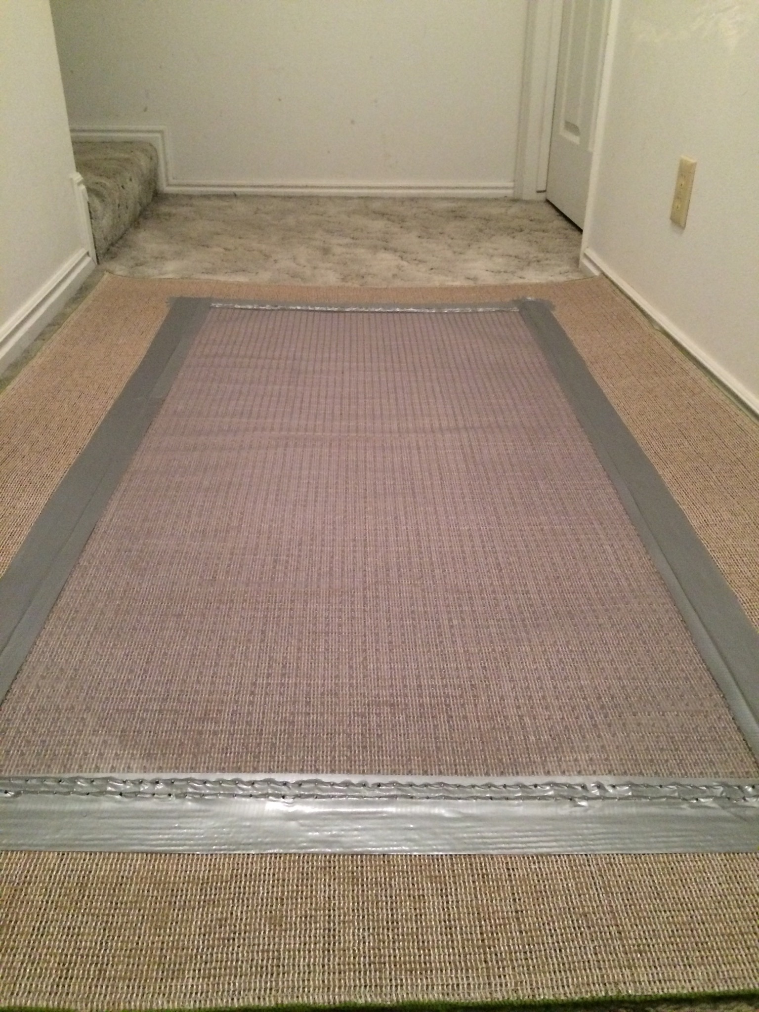 How to Secure an Area Rug on Top of Carpet