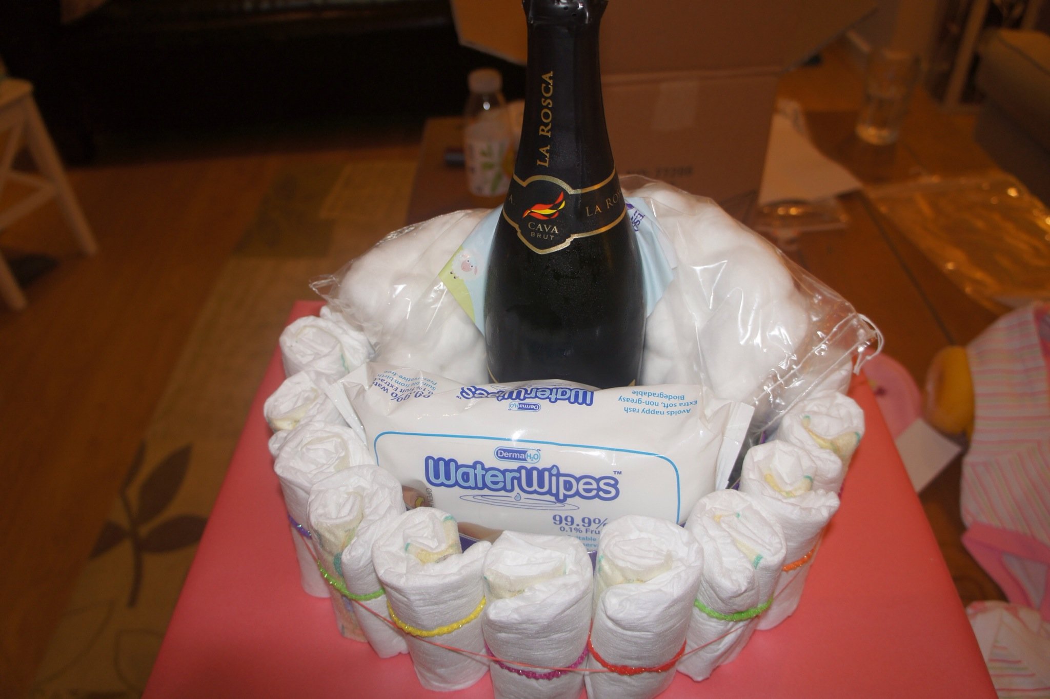 Diaper cake with wine 2024 bottle in the middle