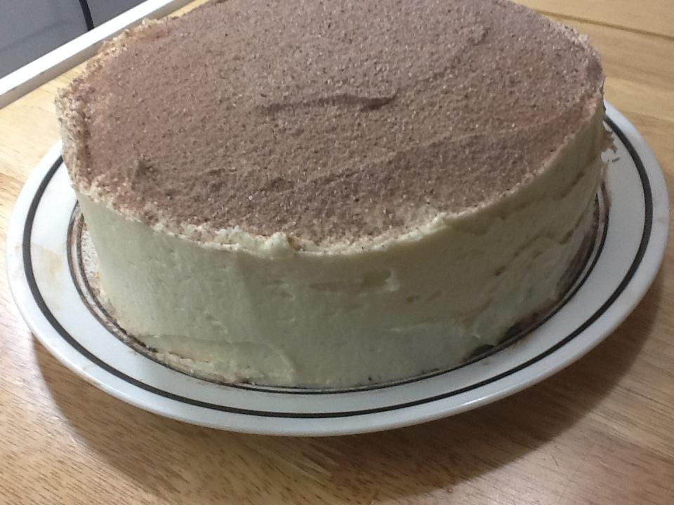 Slice of chocolate cake with tiramisu cream and cocoa powder on white plate  isolated on white background. Stock Photo | Adobe Stock