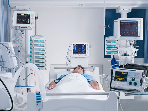 patient in hospital bed icu