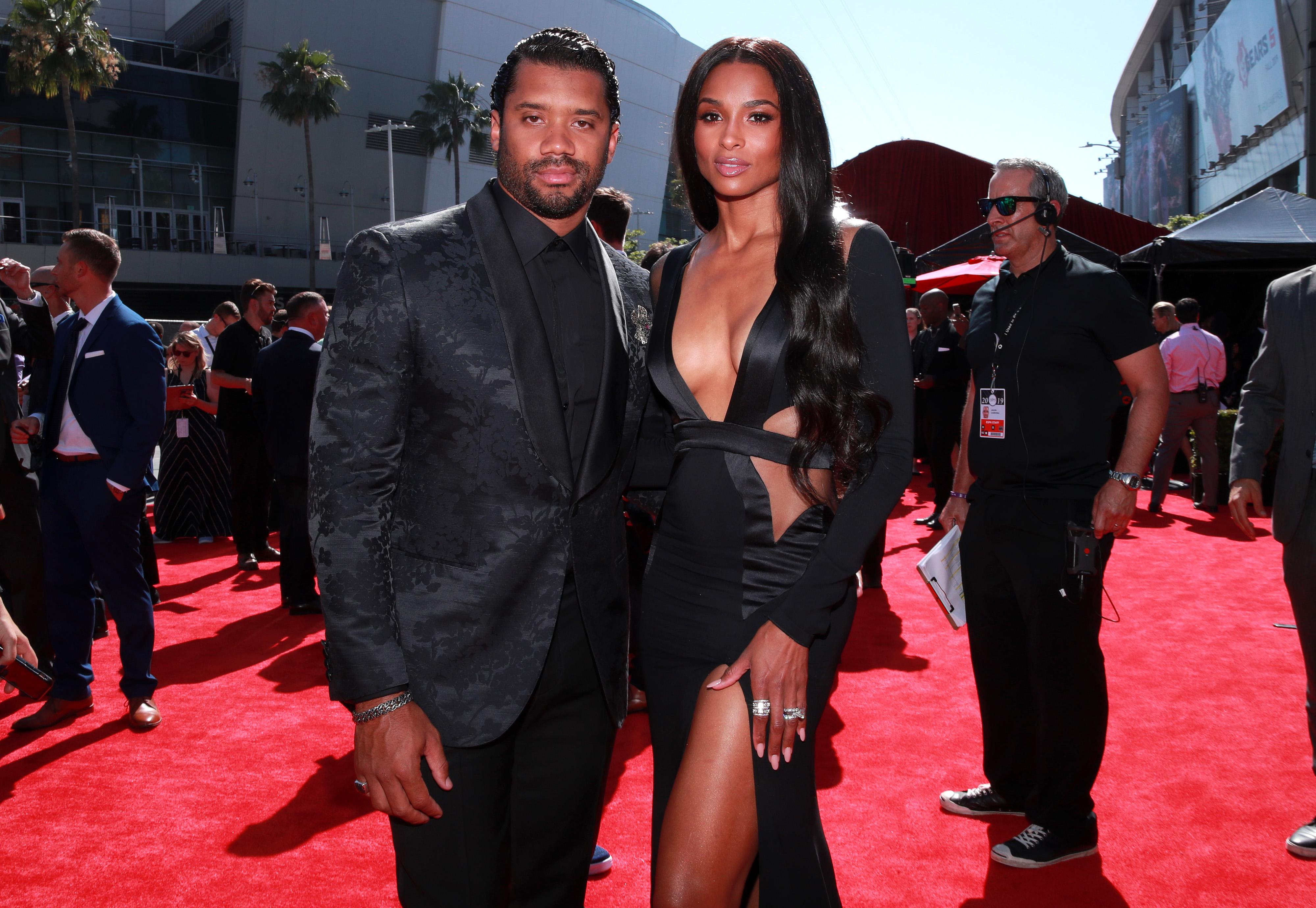 Ciara and husband Russell Wilson look loved-up at basketball match