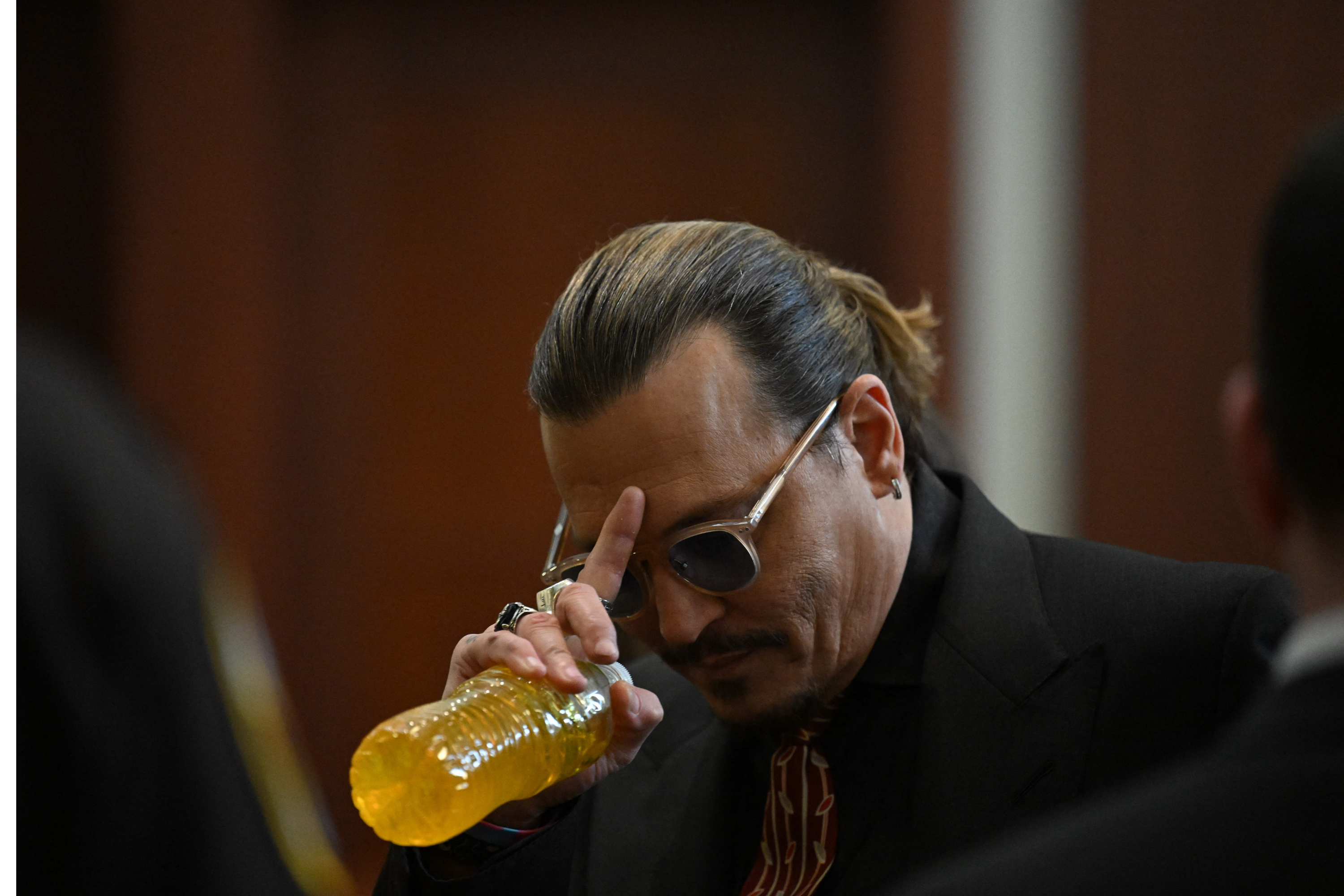 This is why the mysterious liquid in Johnny Depp's courtroom water bottle was yellow