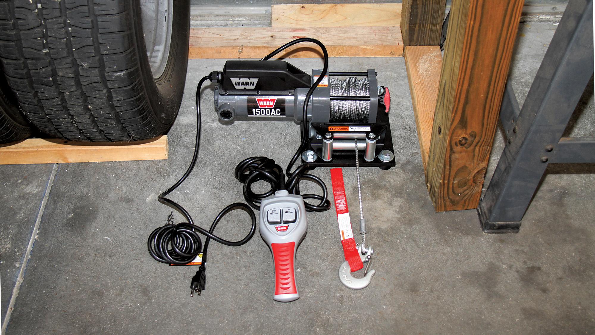 Installing an electric winch in your garage makes moving vehicles easy