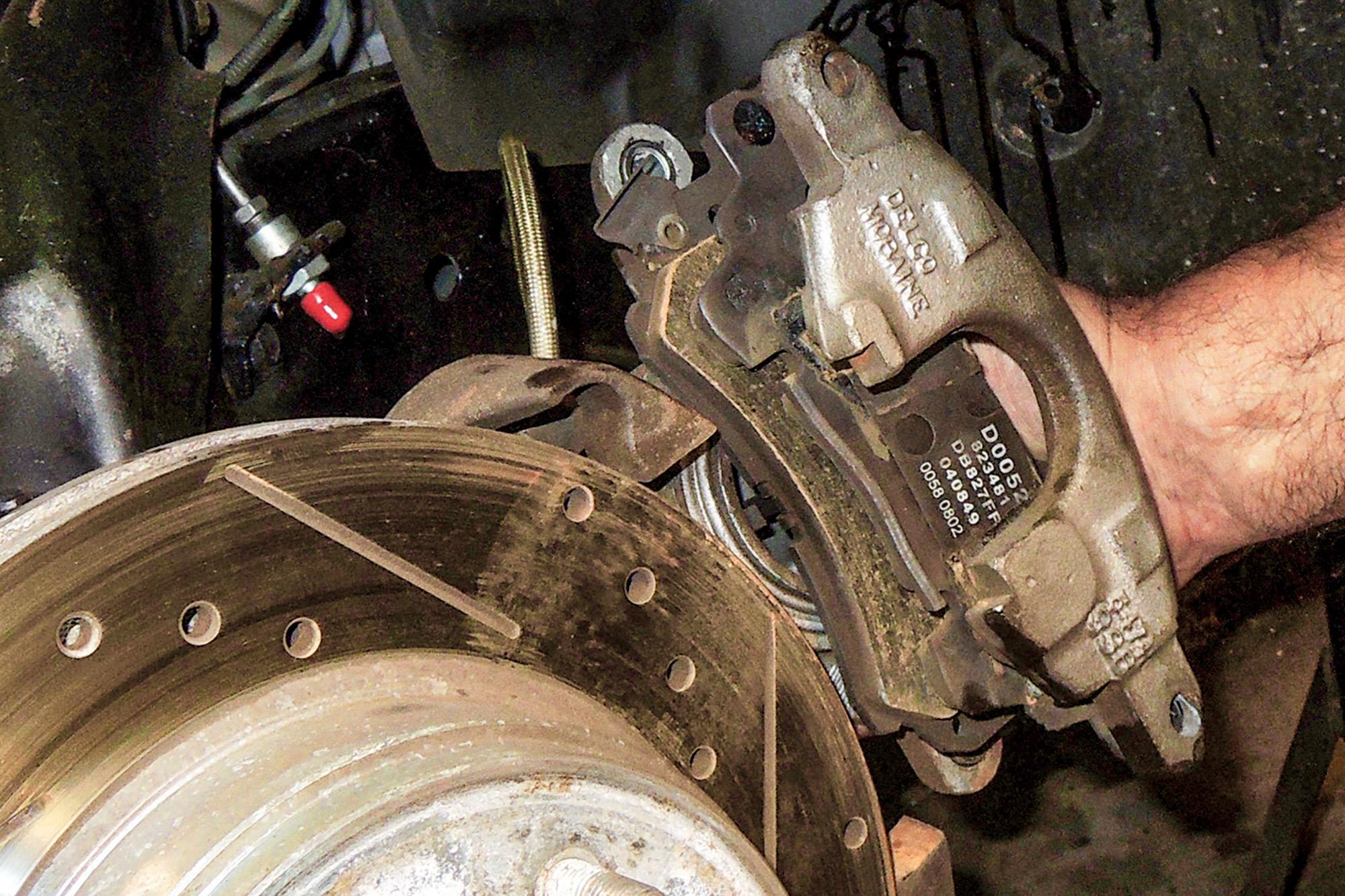 In two hours we had better brakes on our Chevelle with an aluminum caliper swap