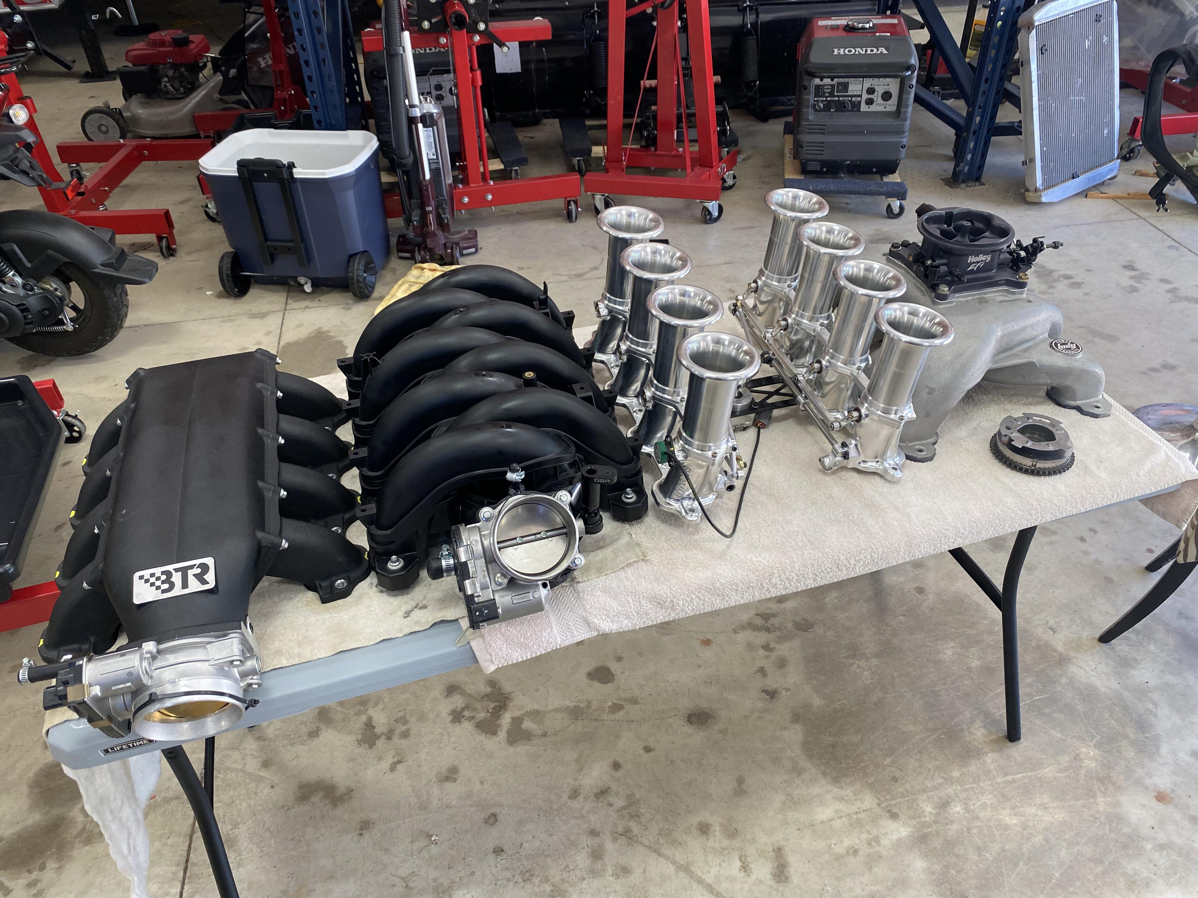 What are the benefits of an aftermarket intake manifold?