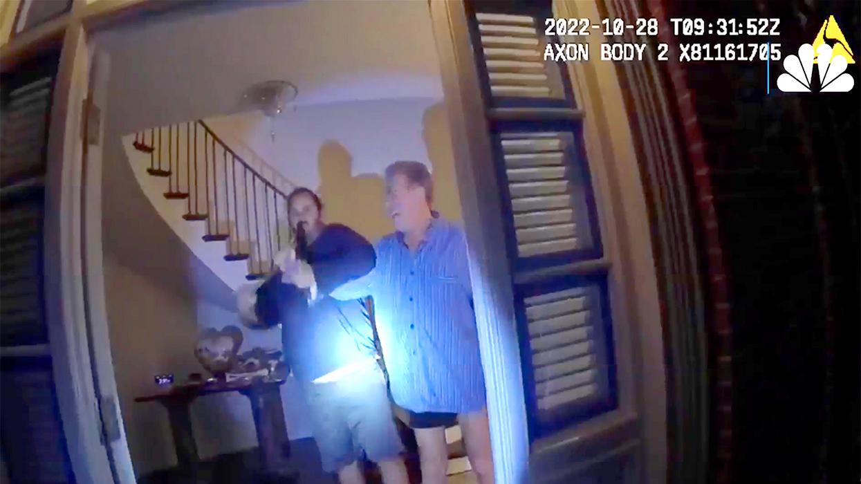 Alleged attacker David DePape inside the home of Paul Pelosi who appears to be struggling with the intruder over a hammer.