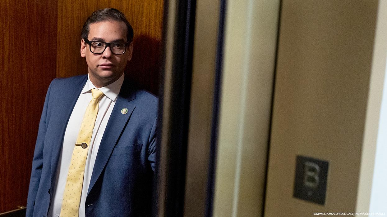 Rep. George Santos standing the the back corner of a congressional elevator for members.