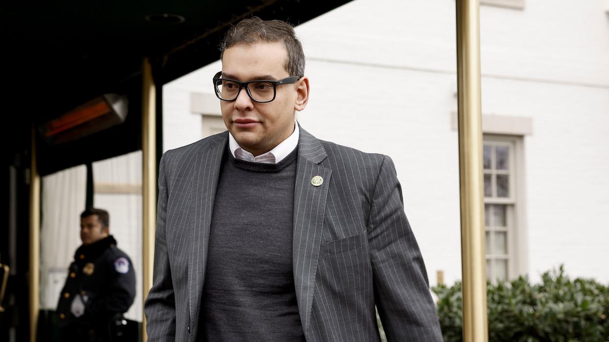 Rep. George Santos coming out of a building