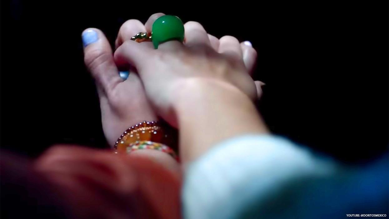 Two women holding hands