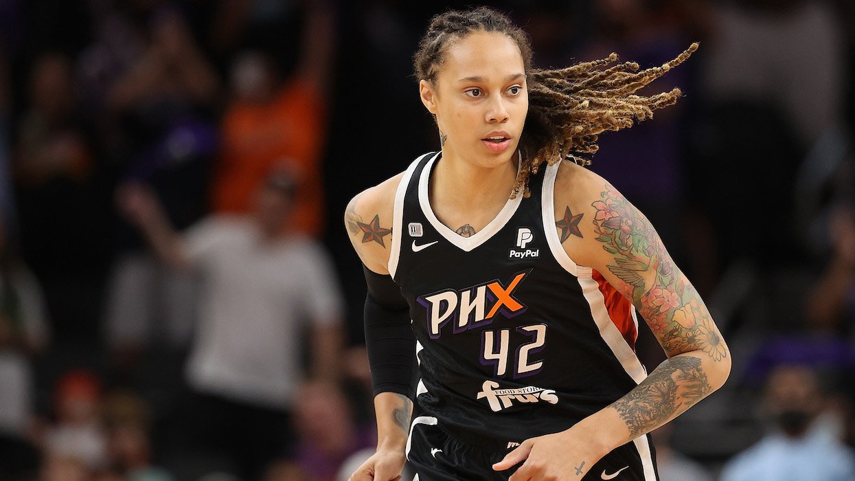 Brittney Griner in a Phoenix Mercury uniform playing basketball