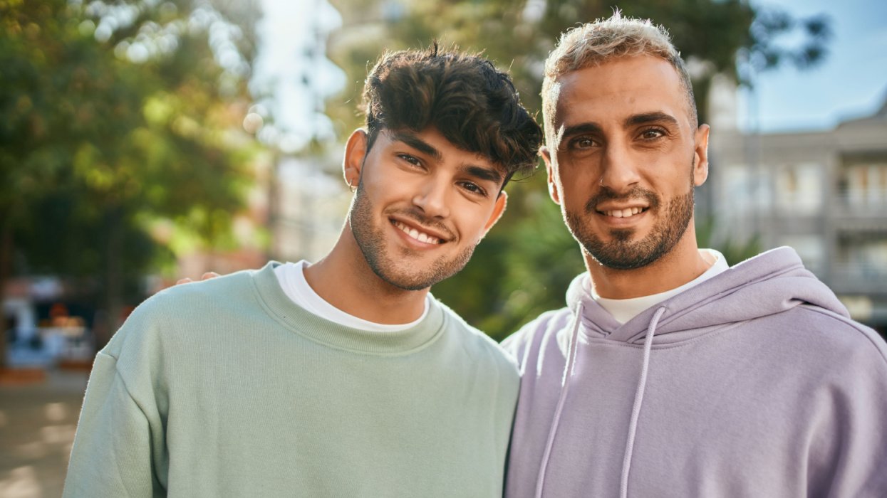 Two men standing together smiling