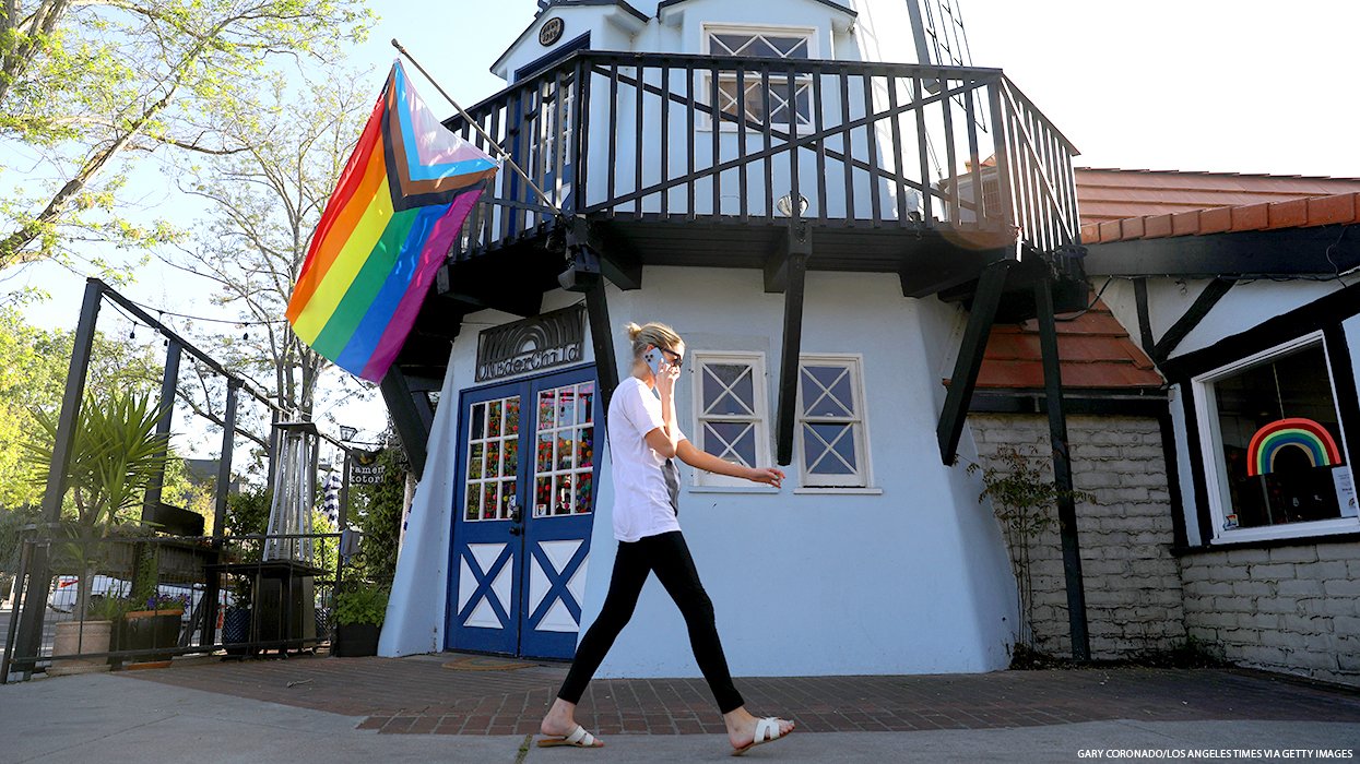 A Pride Flag outside a picturesque building in Solvang, Calif.