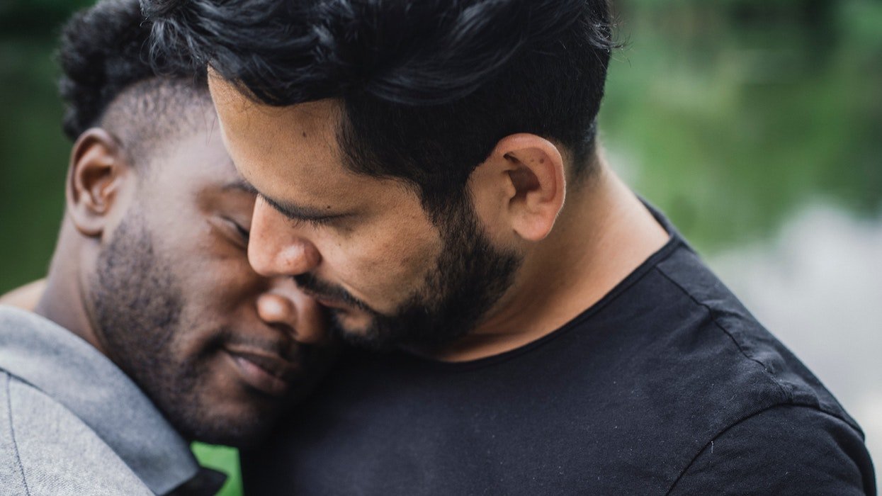 Two men embracing