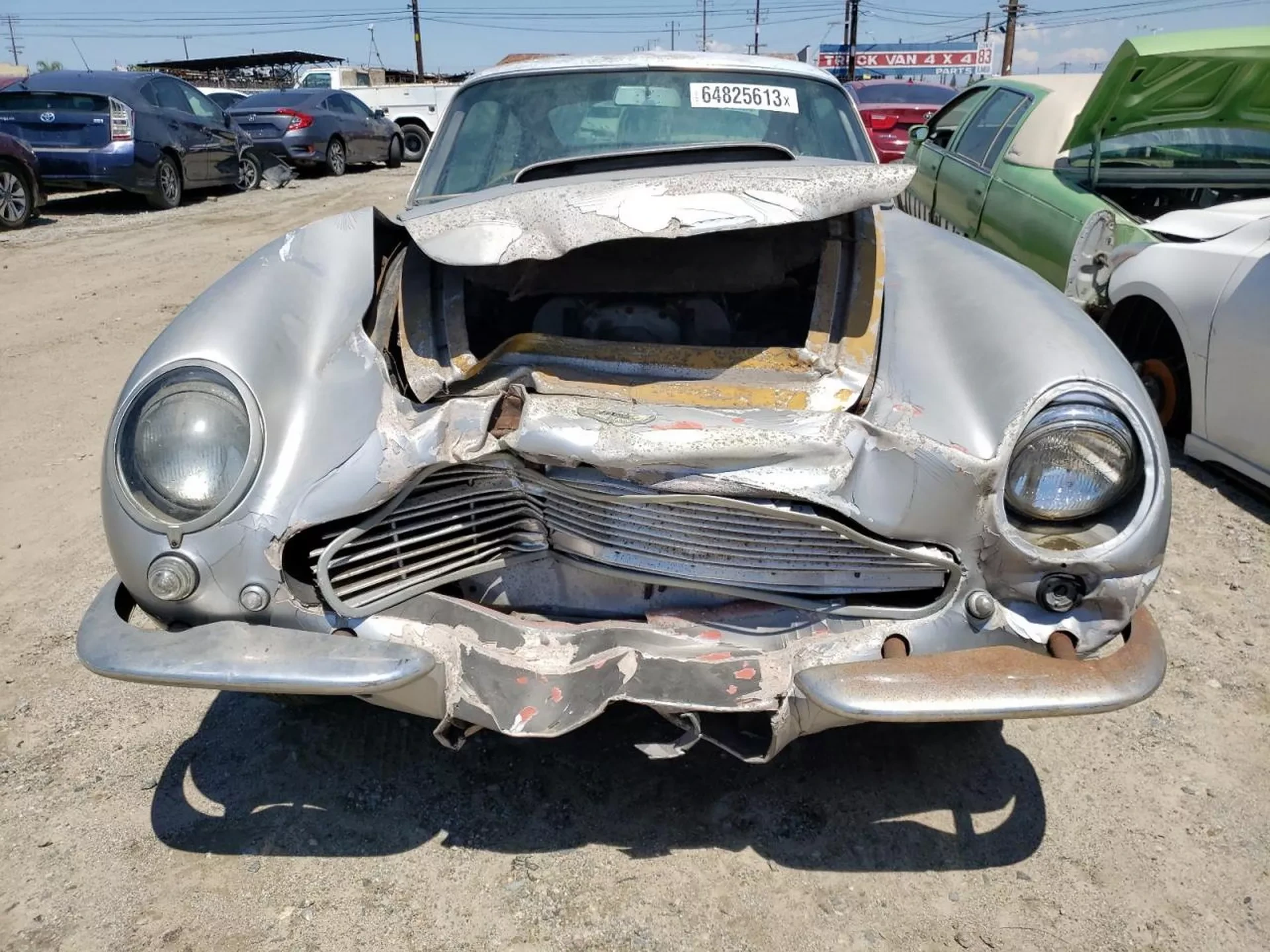 Is This Wrecked Junkyard Aston Martin DB6 that Sold for $66k the Deal of a Lifetime?