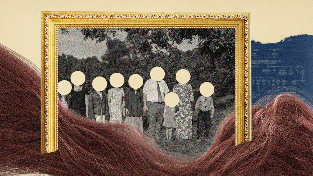 Image of black and white family photo in a frame with the faces obscured 