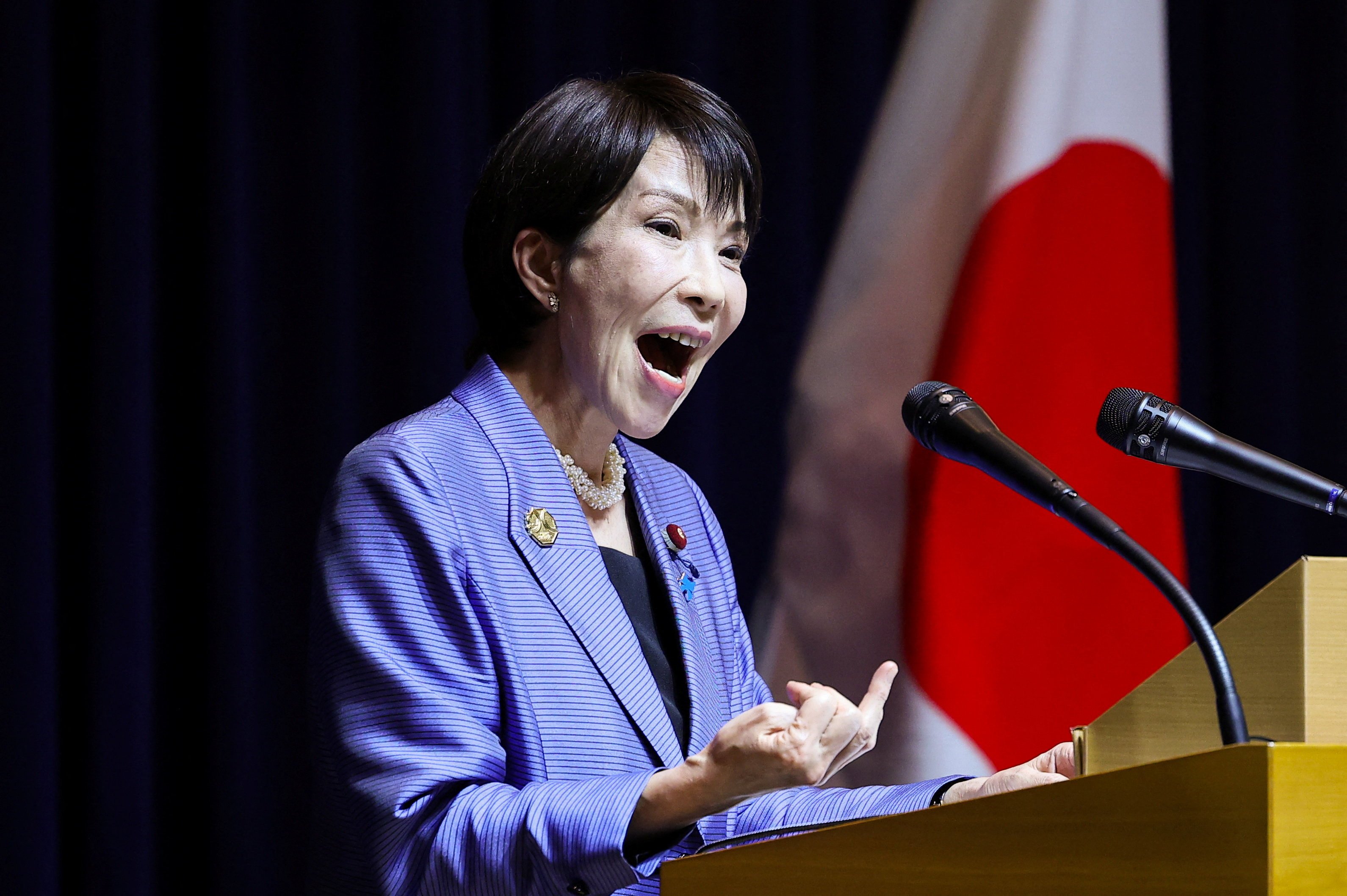 Japan's PM says gender roles add hours to her workday