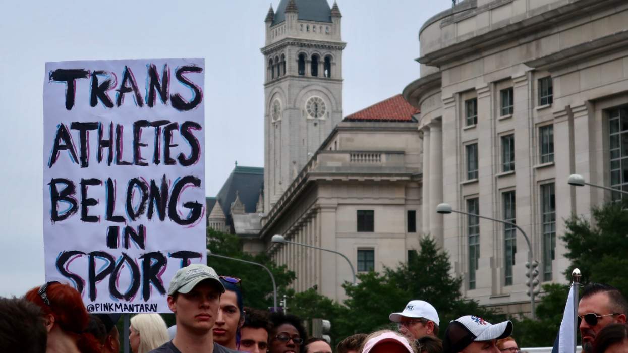 "Trans atheletes belong in sports" protest sign
