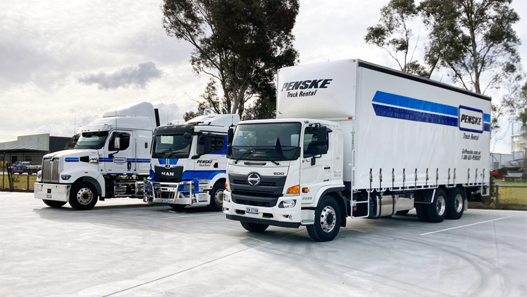 Three Penske Trucks