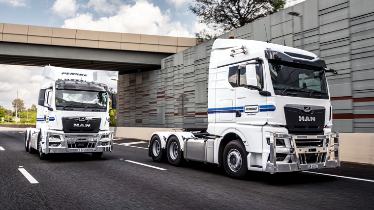 Two Penske Trucks