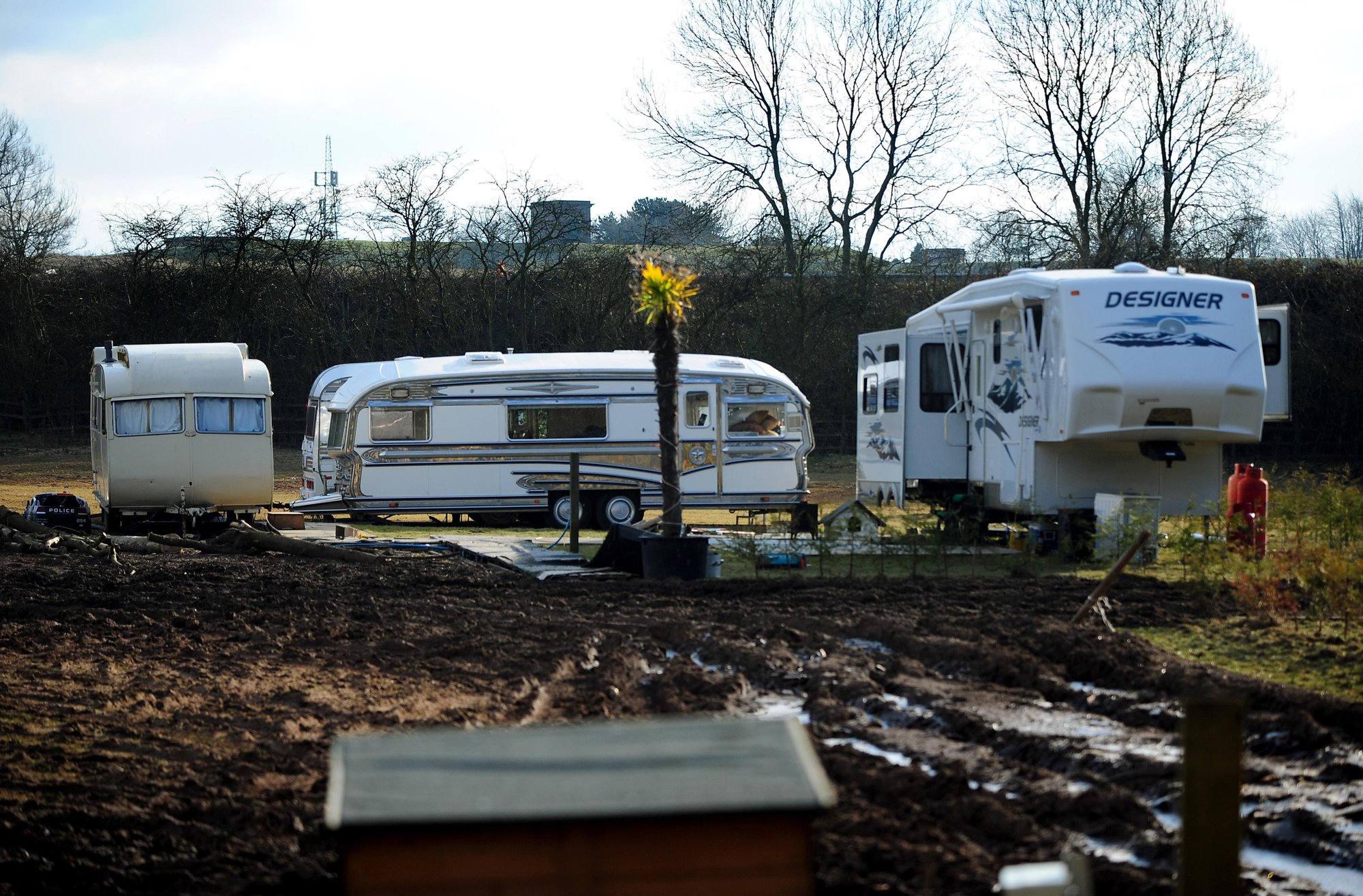 Neighbours demand travellers are jailed for turning quiet fields into sprawling caravan park