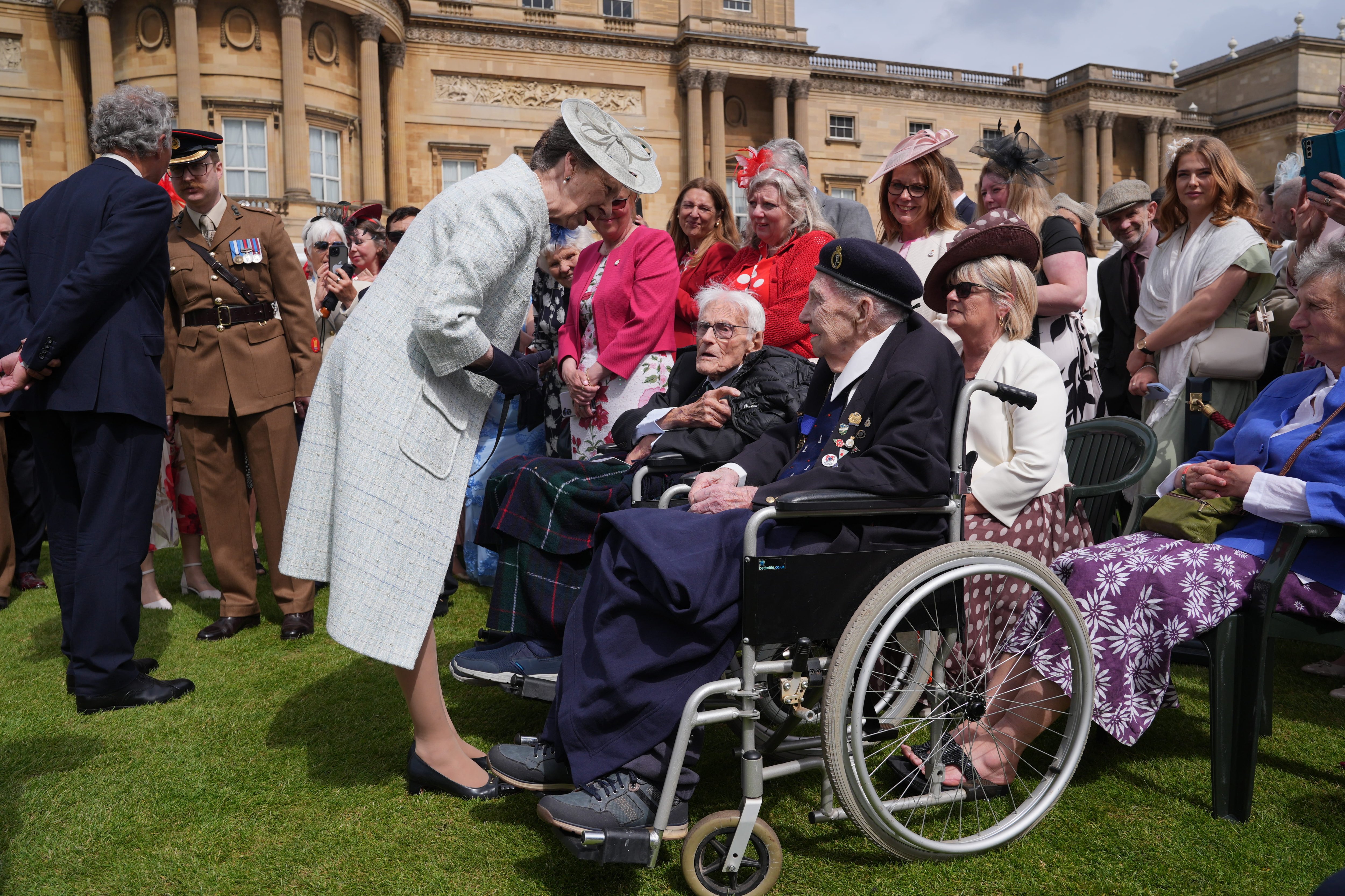 Princess Anne told to 'slow down' by veteran, 100, at Buckingham Palace garden party