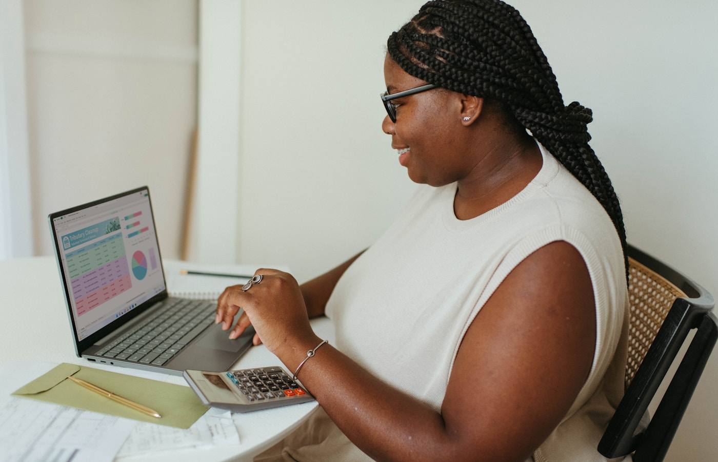 Financial analyst working at laptop