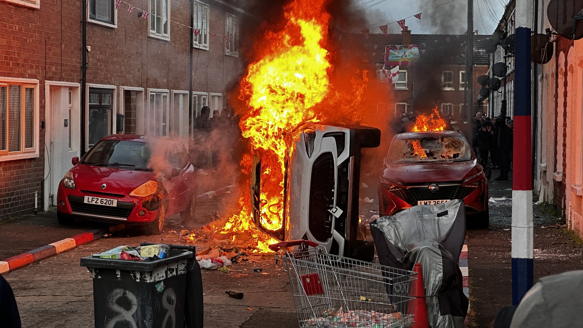 Three people arrested over Belfast protests but 'more will s