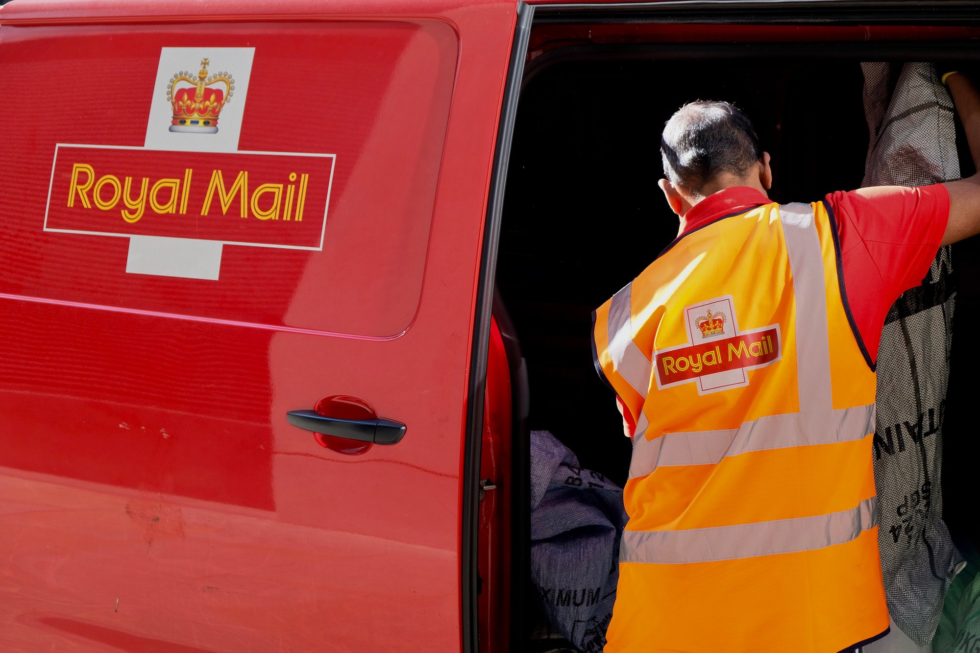 Royal Mail profits more than halve amid Labour's tax raids and declining letter volumes