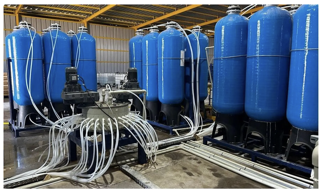 Large blue industrial tanks at CleanTech Lithium's DLE Pilot Plant
