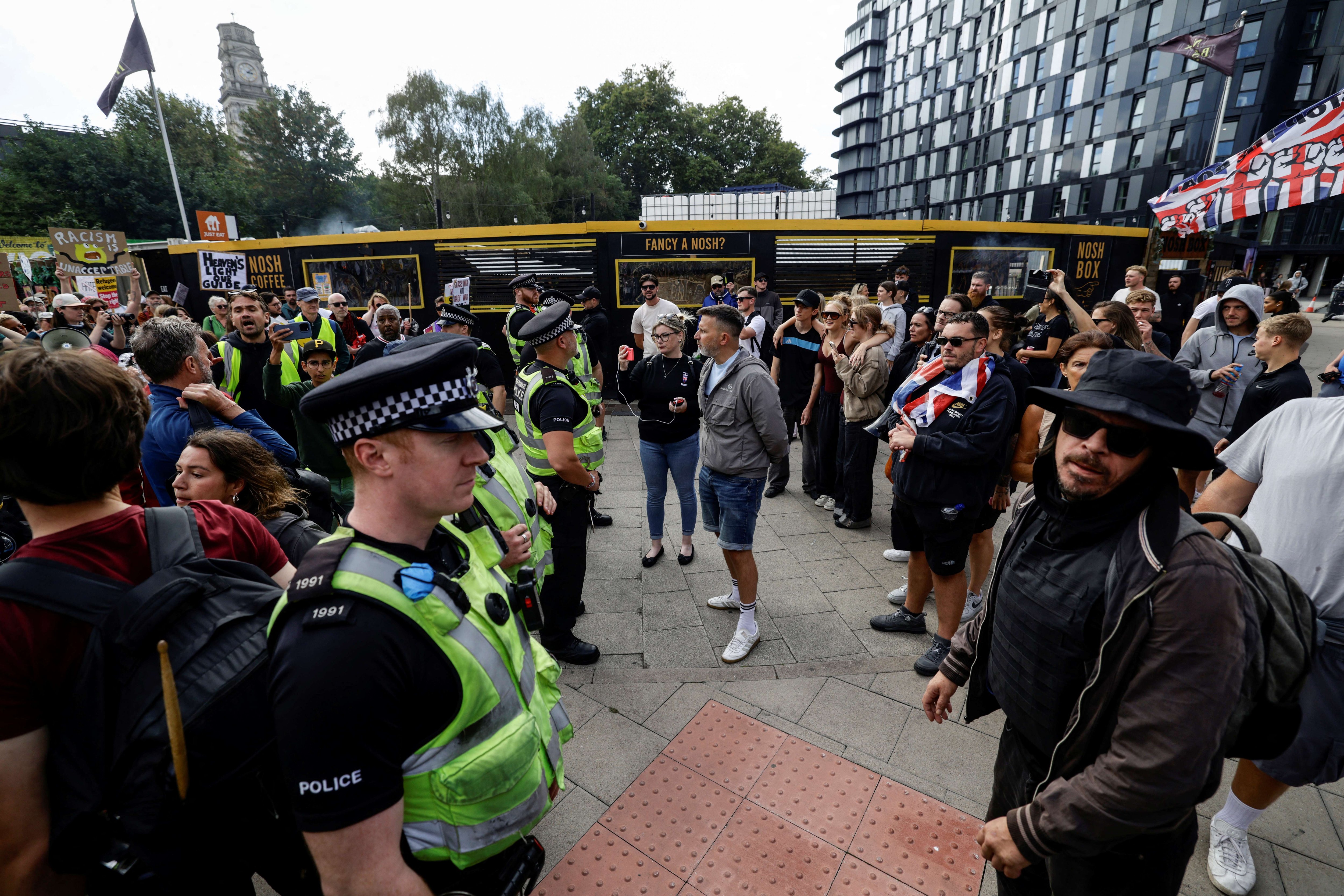 Police detain anti-migrant protesters in Portsmouth as unrest in city grows