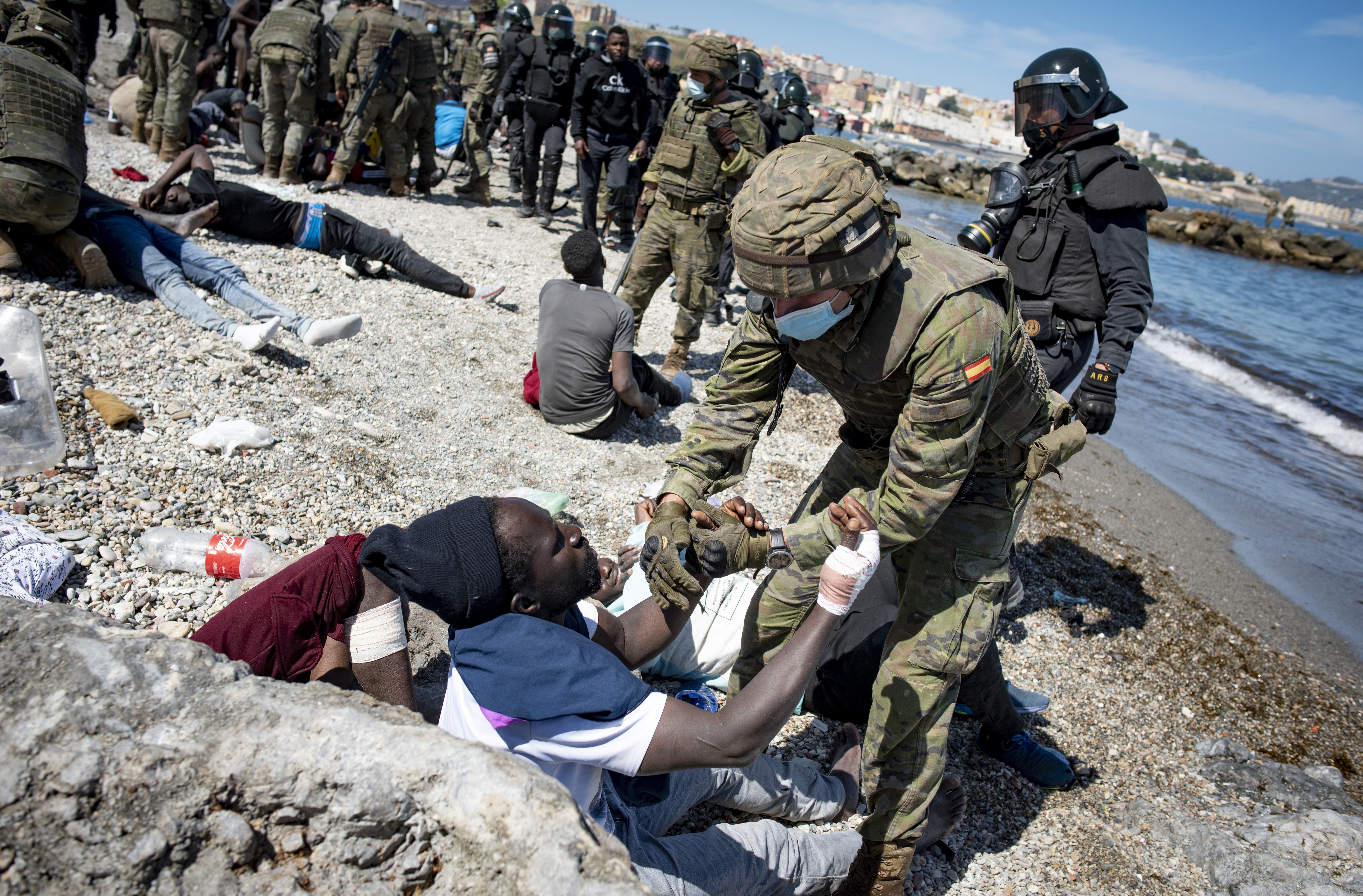 Two soldiers 'injured by migrants' evacuated from Ceuta as Spanish authorities struggle to control invasion