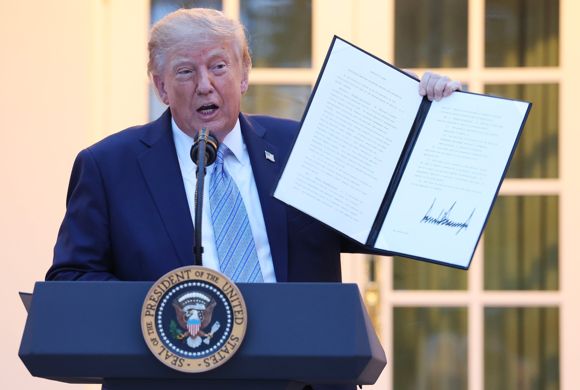 Donald Trump bans three 'fake news' media outlets from White House and fires warning shot at BBC