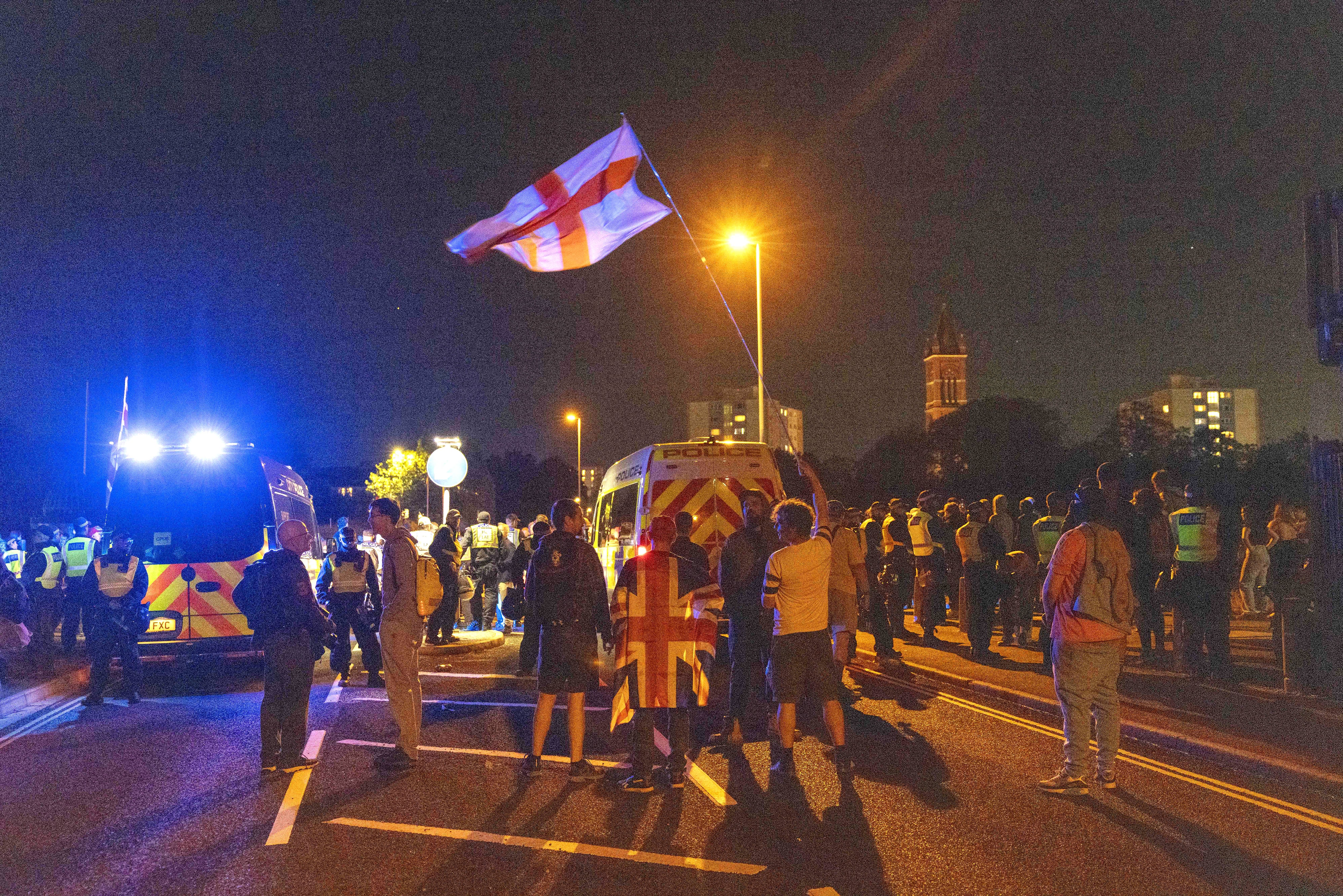 Hundreds of anti-migration protesters face police in Gosport amid fury over 'police escorts to invading men'