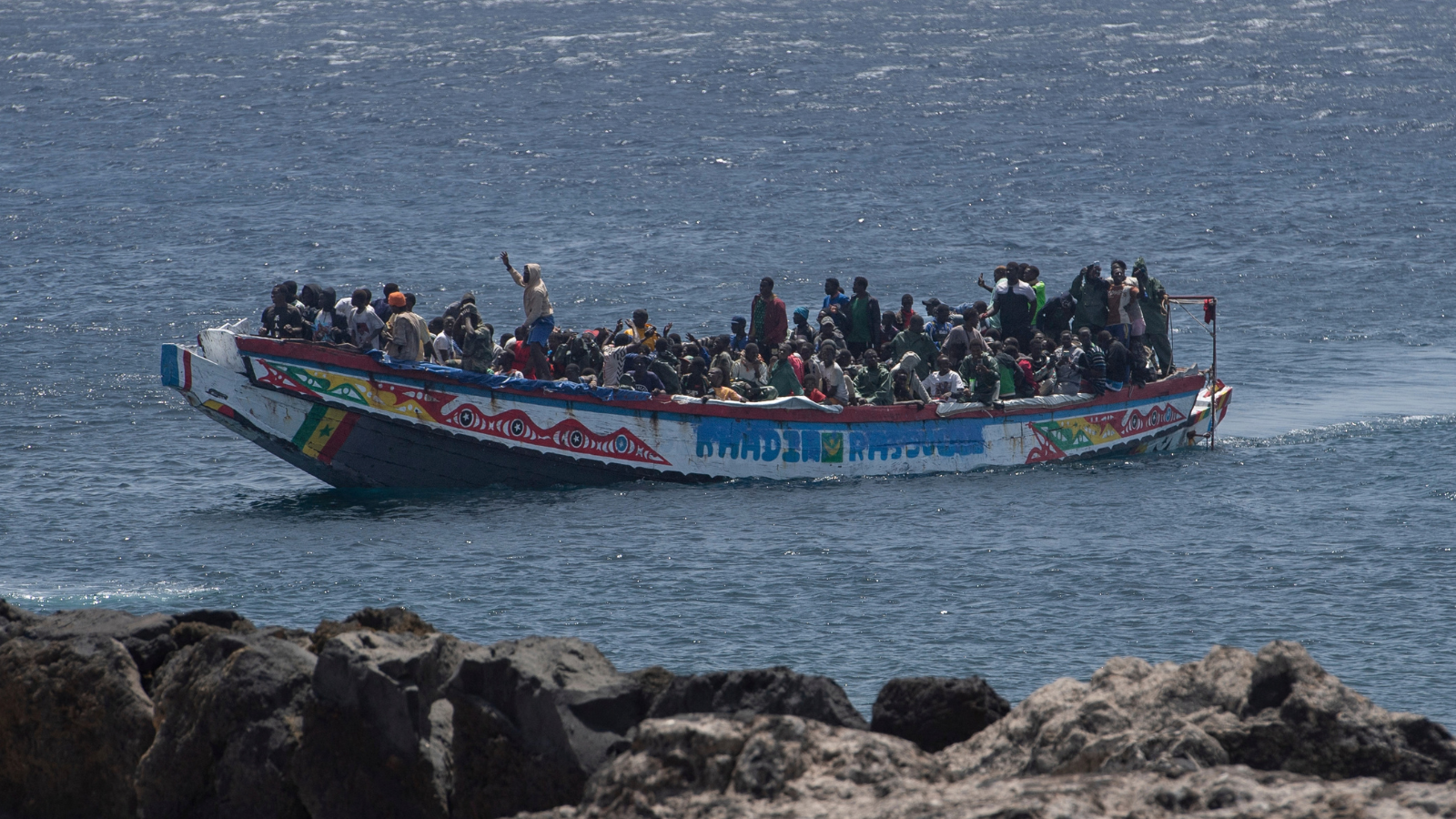 Three illegal migrants arrested after woman 'gang-raped on dinghy' in international waters